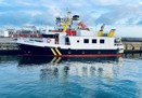 White and black ferry alongside Søby Shipyard repair berth