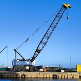 Large blue crane on quay