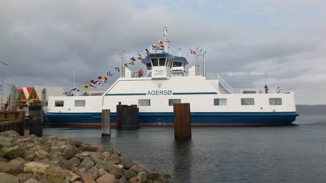 White ferry with flags