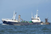 Blue fishing vessel at sea