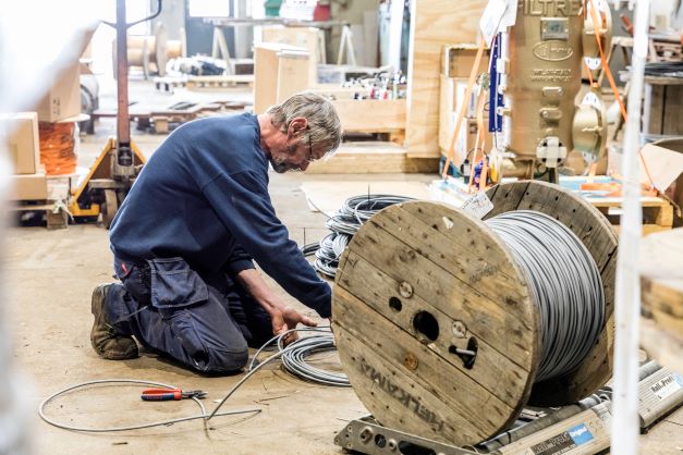 A man and a cable drum